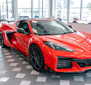 Red sports car in showroom